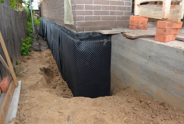 SJ Waterproofing Pros technician performing targeted Exterior Waterproofing assessment in Bellbrook, OH